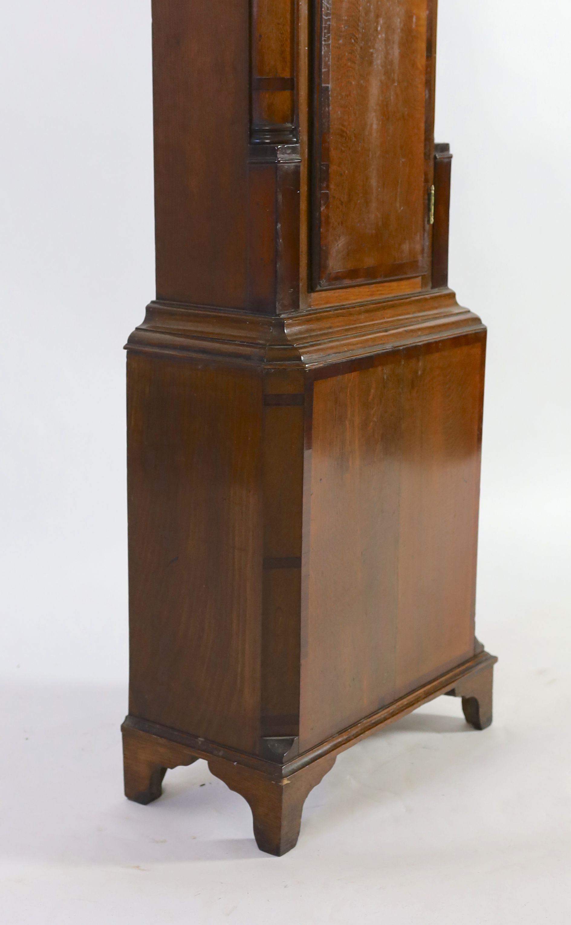 An early 19th century mahogany banded oak cased thirty hour longcase clock, with 25cm square brass dial, height 207cm